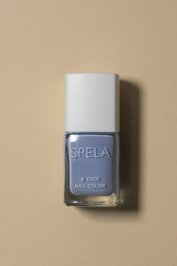 spela blissed out nail polish on color background