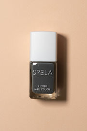 spela nail polish activated charcoal on color background