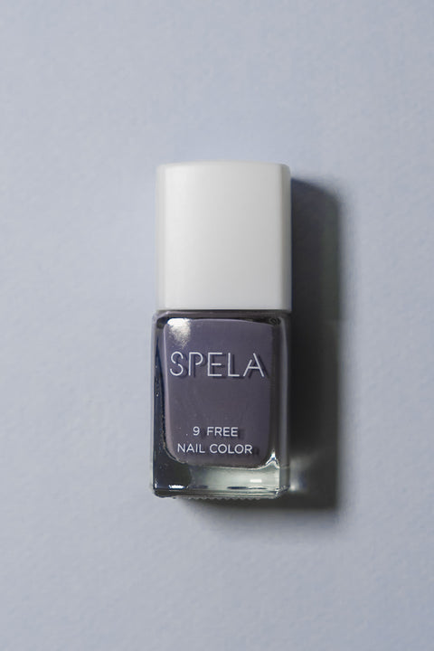 spela up all night nail polish on color background