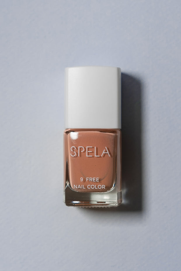 spela skin contact nail polish on color background